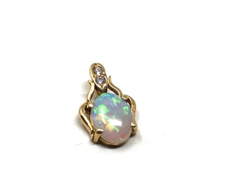 Small 18ct gold diamond &amp; opal pendant weight 0.8g measures approx 1.3cm drop by .8cm wide 