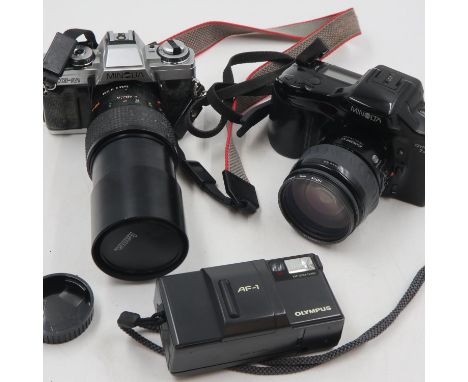Minolta Dynax 7XI and XG-M 35mm film cameras and lenses and Olympus AF-1. All three camera battery compartments are corrosion