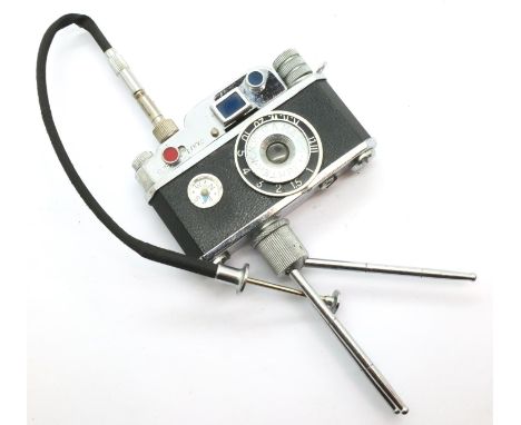 KKW novelty miniature camera lighter on tripod, H: 12 cm including tripod. P&amp;P Group 1 (£14+VAT for the first lot and £1+