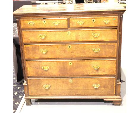 A George III oak and mahogany cross banded chest comprising two short above four long graduated drawers, 120 x 54 x 113 cm H.