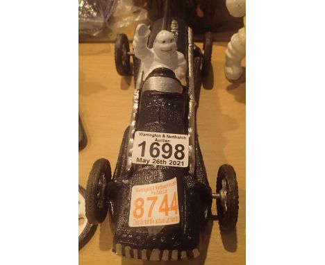Cast iron blue Michelin Man racer, L: 26 cm. P&amp;P Group 2 (£18+VAT for the first lot and £3+VAT for subsequent lots) 