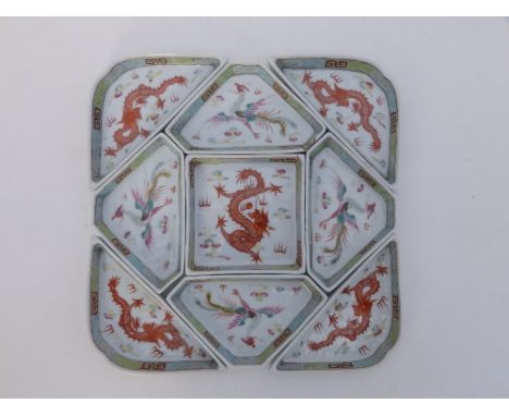 A rare Chinese nine piece square porcelain dragon &amp; phoenix supper set, each piece decorated with either an Imperial rust