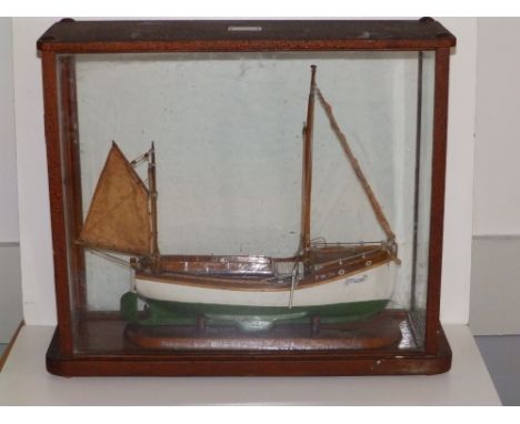 An early 20thC cased display scale model of the small 'Passenger Boat Miss Newquay, 1/2 " to the Foot', the glazed case beari