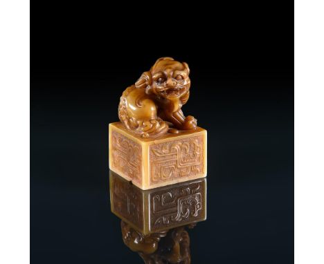 
	
		A Chinese soapstone seal, early 20th century, the finial carved as a recumbent single horned beast, 8cm high
		
		Condit