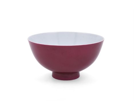 
	
		A Chinese ruby glazed bowl, mark of qianlong but later, the exterior covered with bright ruby coloured glaze, 15.2cm dia