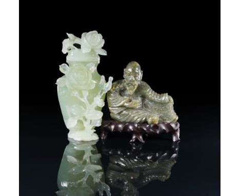 
	
		A Chinese green jade figure of a seated man, 20th century, 11cm wide, fitted wood stand and a Chinese celadon jade or ha