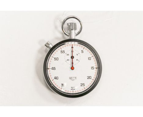 Original Heuer open face race stopwatch. Coated aluminium case, numbered 17303. Signed manual wind calibre 7701. White dial. 