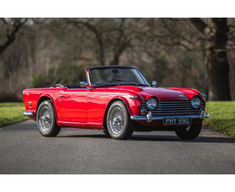 Classic British thoroughbred motoring at its very best.Stunningly presented in Signal Red with a Black leather interiorThe su