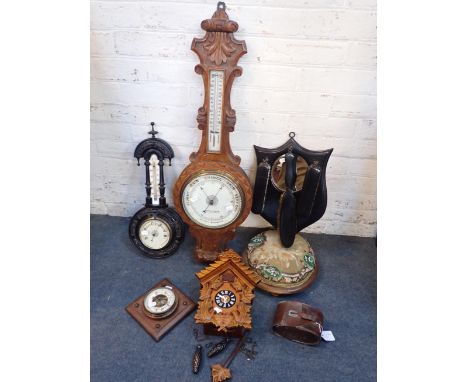 A VICTORIAN OAK-CASED ANEROID BANJO BAROMETERan ebonised barometer, another of lozenge form, a modern cuckoo clock (battery),