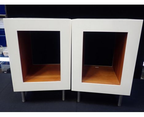 A PAIR OF MODERNIST BEDSIDE CABINETSwhite open rectangles with light cherrywood lining, on steel feet 52cm high x 34cm x 30cm
