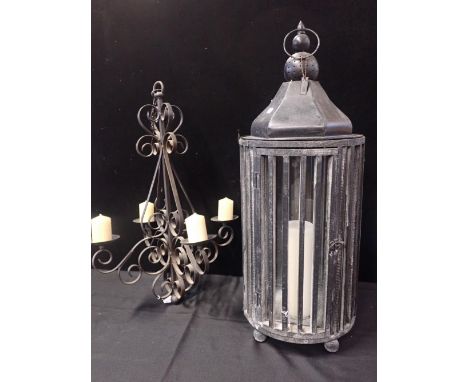 A LARGE MODERN HANGING CANDLE LANTERNwood and metal, glazed, and a wrought iron four branch chandelier (for candles) (2)