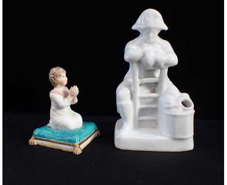 A 19th CENTURY INKWELL OR ENCRIER MODELLED AS NAPOLEONseated on a reversed chair, 'blanc de Chine' style porcelain 12.5cm hig