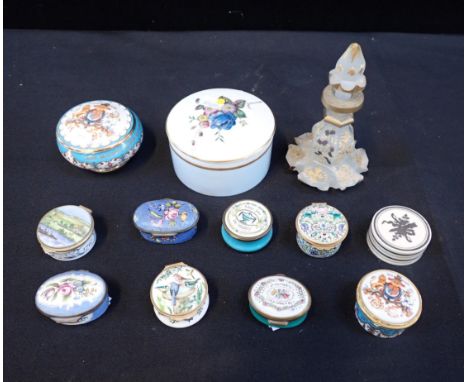 A COLLECTION OF ENAMEL BOXESincluding Halcyon Days, Billstone and Battersea and others with a gilded glass scent bottle and a