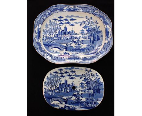 A BLUE AND WHITE 'GOTHIC CASTLE' MEAT DISH AND MATCHING DRAINERwith gravy well, possibly Spode, but unmarked  c.1820, 37.5 x 