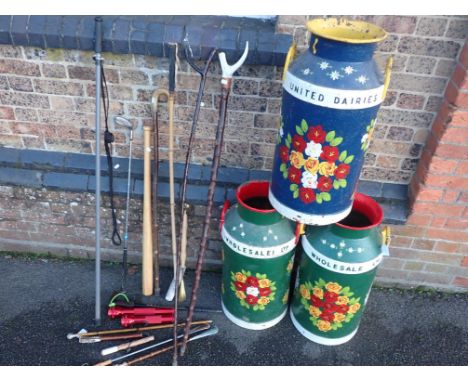 THREE 'UNITED DAIRIES' MILK CHURNS, PAINTED IN BARGE STYLEwith flowers on a blue and green ground, each 70cm high, and a vari