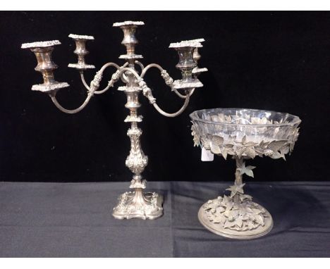 A VICTORIAN SILVER-PLATED TAZZA STANDcast with entwined fruit (with later glass bowl), and a five-light silver-plated candela