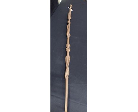 AN AFRICAN STAFF OR WALKING STICK CARVED WITH SNAKES AND CLIMBING FIGURESwith head terminal 117cm long