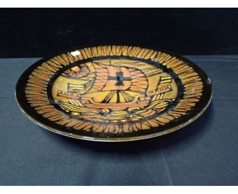 LARGE POOLE POTTERY AEGEAN DISH painted with a ship design, 41 cms diam