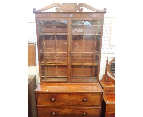 A REGENCY MAHOGANY SECRETAIRE BOOKCASEthe glazed top section with old glass, pierced pediment and fitted interior 230cm high,