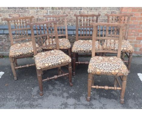 A MATCHED SET OF SIX LANCASHIRE SPINDLE-BACK CHAIRSash, and other woods, with rush seats, and squabs in Morris pattern fabric