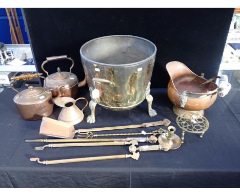 A BRASS FOOTED PLANTERwith a copper coal scuttle, brass fire irons, copper kettles and other metalware