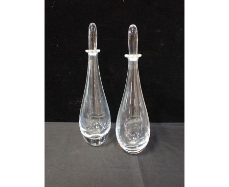 A PAIR OF ORREFORS DECANTERSlightly etched with fish designs, 35 cms high