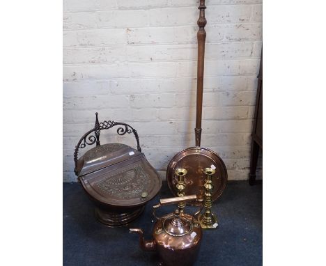 A VICTORIAN EMBOSSED COPPER COAL SCUTTLEwith maker's mark under lid, a pair of brass candlesticks, a copper kettle, and a war