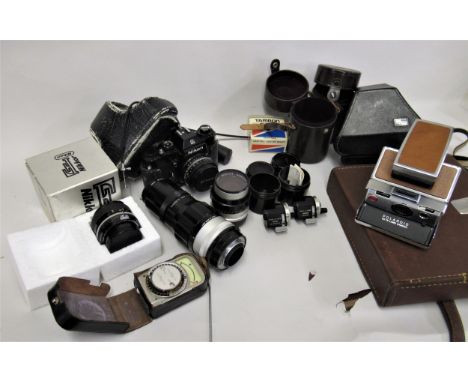 Nikon EL 35mm camera together with four various Nikkor lenses, a cased inclinometer, two Russian viewfinders and other photog