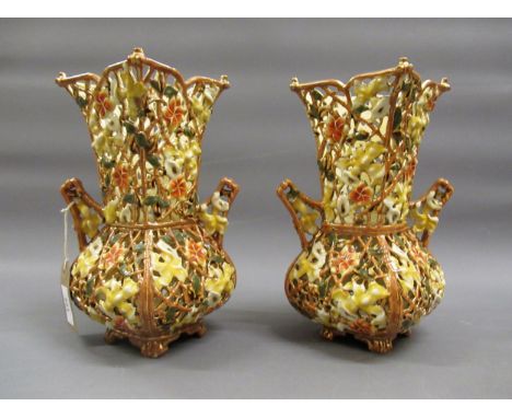 Pair of Zsolnay Pecs square baluster reticulated vases with typical pierced polychrome floral decoration and shaped side hand