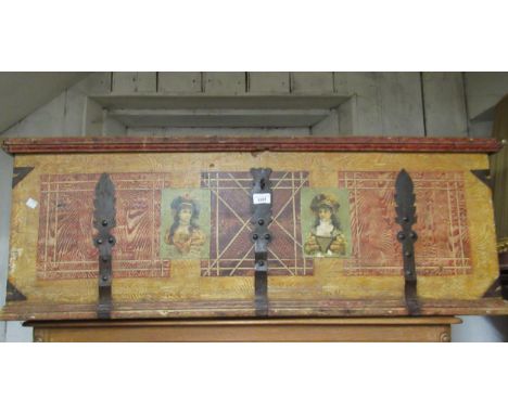 19th Century Continental painted pine and metal bound trunk with hinged lid and applied printed decoration, 45.5ins wide 