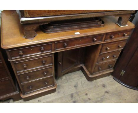 19th Century mahogany inverted breakfront dressing table with nine pedestal drawers and a centre door on plinth base, 48ins x