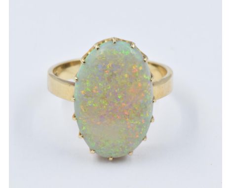 9ct Gold ring set large oval opal of good colour, approximately 21 x 14mm overall, size 'R' 