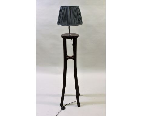 Modern stained beechwood floor standing lamp, with splayed square supports and green pleated shade, 61ins high 
