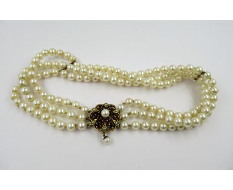 Triple row uniform cultured pearl choker with 9ct gold garnet and cultured pearl set clasp with drop, 33.5cms 
