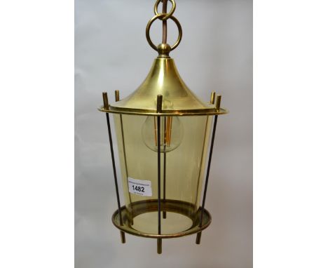 Brass and steel hanging lantern, with tapered tinted glass shade on a long chain with ceiling rose 