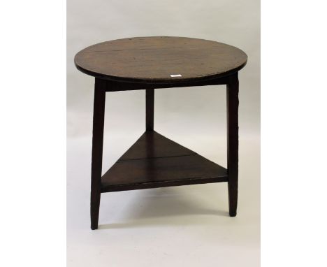 19th Century oak and pine circular cricket table with undertier on three shaped supports 