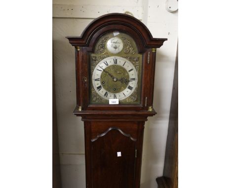 Edwardian mahogany longcase clock, the arched brass dial with silvered chapter ring and Roman numerals, the three train movem