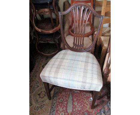 Set of four mahogany Hepplewhite style shell back dining chairs, with overstuffed seats raised on square tapering front suppo