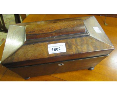 19th Century rosewood sarcophagus shaped two division tea caddy on low bun supports (at fault)Please see further images. 