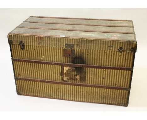 E. Goyard Aine, late 19th Century French canvas bound steamer trunk with original striped canvas covering, and carrying handl
