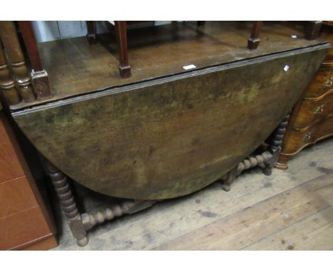 18th Century oak gateleg dining table with single end drawer on bobbin turned supports, 29ins high x 47ins wide x 20ins deep 