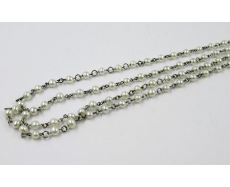 High carat white metal and cultured pearl sautoir (necklace), 94cms longPearls are very small - perhaps 203mm diameter.Colour