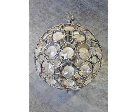 Pair of 20th Century chromium and glass globe form hanging lights, 20ins diameter, together with a similar smaller light, 12i