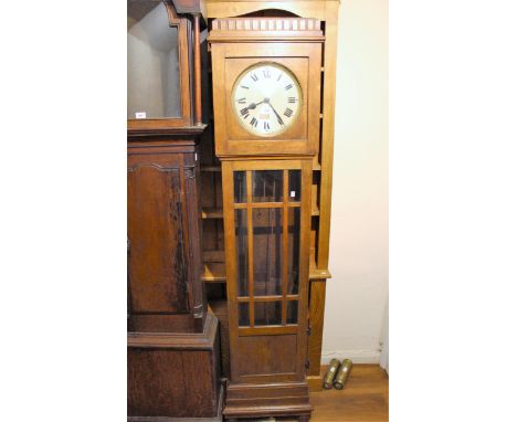 Early to mid 20th Century oak longcase clock, the circular silvered dial with Roman numerals and three train weight driven mo