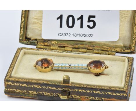 Unmarked yellow metal enamel and citrine bar brooch, 35mm wide, 3.5g, in original box 