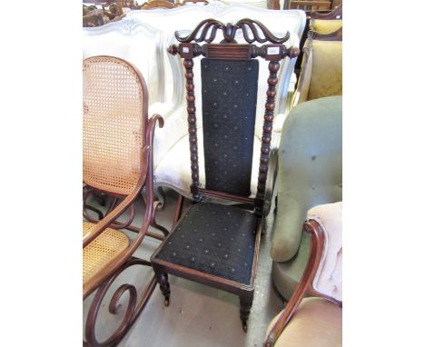 Victorian oak prie dieu chair, the carved cresting rail above a padded back with flanking bobbin turned uprights, drop-in sea