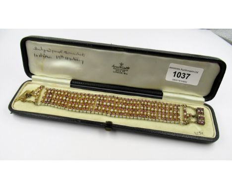 19th Century Indian yellow metal seed pearl and pink ruby bracelet, 20cms x 3cms approximately, 42.5g, in a Morocco leather c