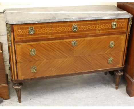 French kingwood marquetry inlaid and ormolu mounted commode, the grey flecked marble top above three short and two long drawe