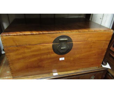 Eastern camphor wood rectangular trunk, the hinged cover above brass lock plate and loop end handles, 31ins wide x 15ins high