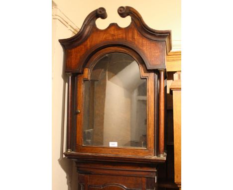 George III oak longcase clock case with a broken arch hood above an arched panel door, with flanking quarter pilasters above 